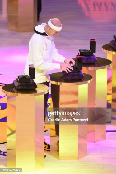 Alex Caruso of the Los Angeles Lakers reacts as he gets his 2019-20 NBA Championship ring during the ring ceremony before the game against the LA...