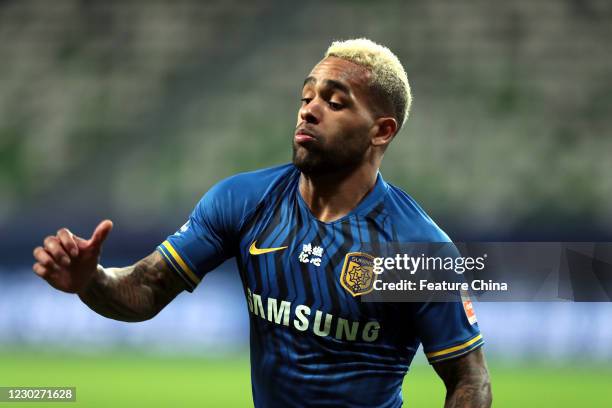 Brazilian footballer Alex Teixeira Santos on Jiangsu Suning, plays in a Chinese Super League match against Shanghai SIPG in Suzhou in east China's...