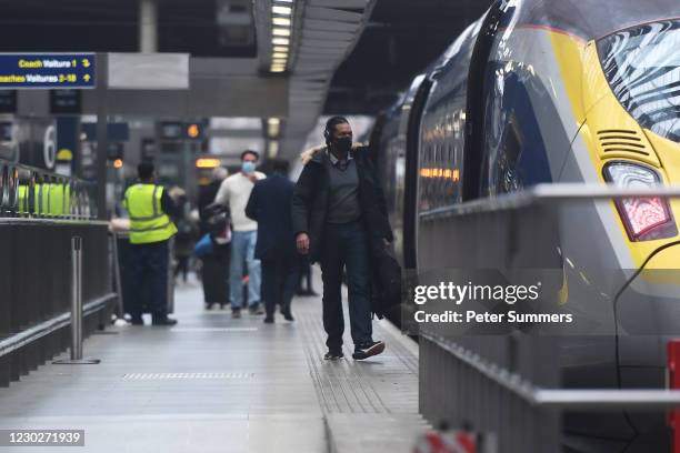 Passengers board a Eurostar service at London St Pancras station on December 23, 2020 in London, England. Train services between London and the...