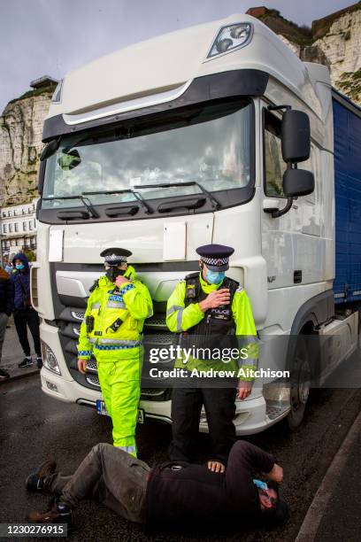 Truck driver tries to blockade a lorry leaving the port as tensions are high between police and drivers who have been waiting over 48 hours for the...