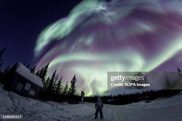 View of aurora borealis storm during midnight in Yellowknife.