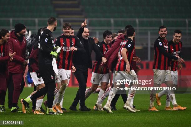 Milan's Italian coach Stefano Pioli , AC Milan's Italian forward Daniel Maldini , AC Milan's French defender Theo Hernandez and teammates celebrate...