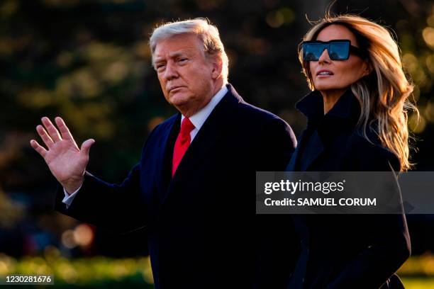 President Donald Trump and First Lady Melania Trump walk towards Marine One as they depart the White House en route to Mar-a-Lago, the President's...