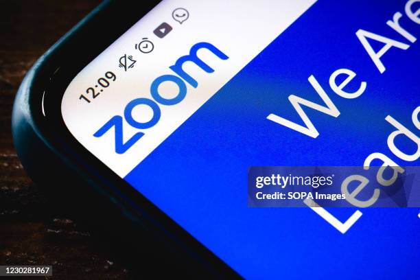 In this photo illustration the close-up of the Zoom Video Communications website seen displayed on a smartphone.