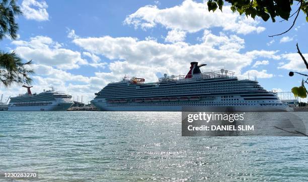 The cruise ships "Carnival Sunrise" and "Carnival Vista" part of the Carnival Cruise Line, are seen moored at a quay in the port of Miami, Florida,...