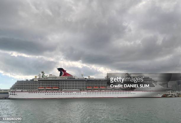 The cruise ship "Carnival Pride" part of the Carnival Cruise Line is seen moored at a quay in the port of Miami, Florida, on December 23 amid the...