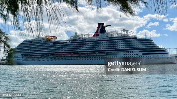 The cruise ship "Carnival Vista" part of the Carnival Cruise Line, is seen moored at a quay in the port of Miami, Florida, on December 23 amid the...