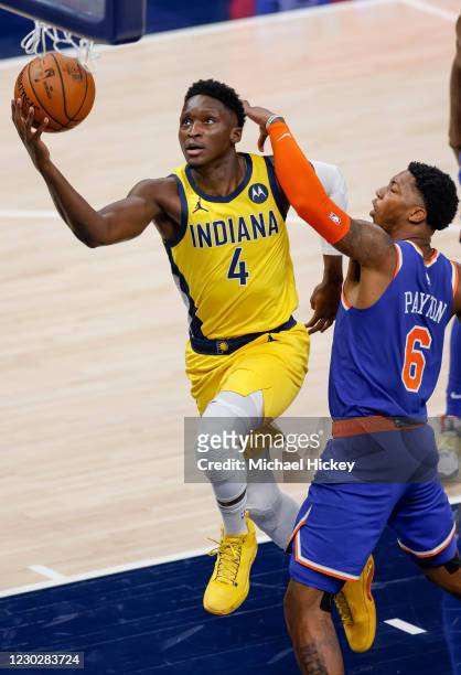 Victor Oladipo of the Indiana Pacers shoots the ball against Elfrid Payton of the New York Knicks during the first half at Bankers Life Fieldhouse on...