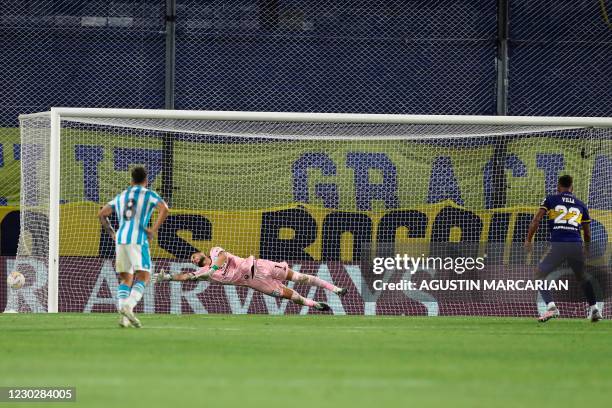 Boca Juniors' Colombian Sebastian Villa scores a panalty past Racing Club's Chilean goalkeeper Gabriel Arias during their Copa Libertadores...