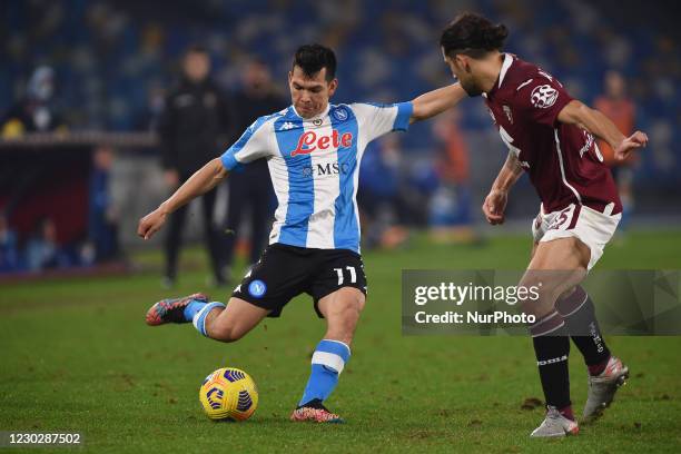 Hirving Lozano of SSC Napoli competes for the ball with Ricardo Rodriguez of Torino FC during the Serie A match between SSC Napoli and Torino FC at...