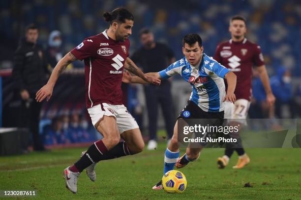 Hirving Lozano of SSC Napoli competes for the ball with Ricardo Rodriguez of Torino FC during the Serie A match between SSC Napoli and Torino FC at...