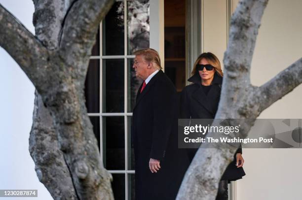 President Donald Trump and First Lady Melania Trump leave the West Wing as they begin their walk towards Marine One on the South Lawn of the White...