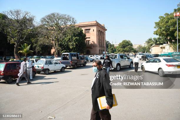 Lawyer walks as a high court ordered to release Omar Saeed Sheikh on the murder case of American journalist Daniel Pearl, outside the Sindh high...
