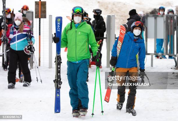 The first skiers are waiting for the ski lift to open in the Semmering ski area, Lower Austria on December 24, 2020. - Austria allowed its more than...