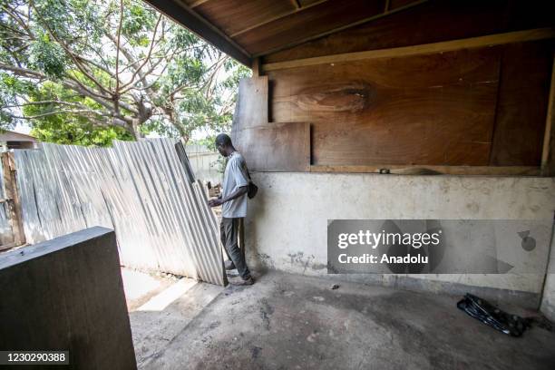 Man inspects at the site after the house of the Former President of Central African Republic, Francois Bozize, located in Boali was shot and set on...