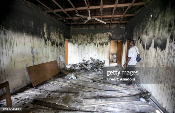 Man inspects at the site after the house of the Former President of Central African Republic, Francois Bozize, located in Boali was shot and set on...