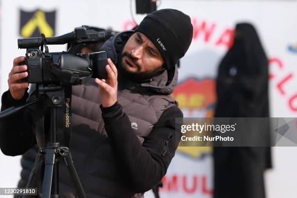 Video Journalist adjusts camera during Jashne- baramulla, In baramulla, Jammu and Kashmir, India on 24 December 2020. Indian Armys two-day youth...