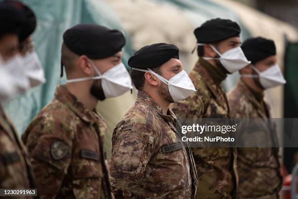 Soldiers lined up inside the covid military field hospital in Cosenza, on December 24, 2020. An Italian army field hospital has been set up near the...