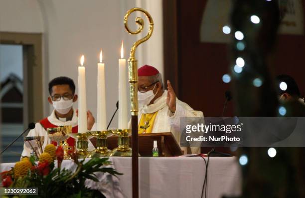 Priest conducts a Christmas Eve mass at the Katedral church in Bogor, West Java, Indonesia on December 24, 2020