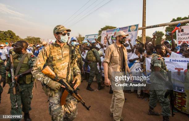 Russian and Rwandan security forces take measures around the site during election meeting of Current Central African Republic President and...