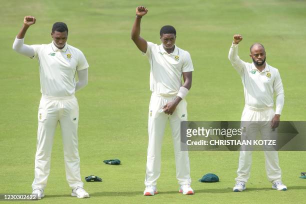 South Africa's Lungi Ngidi , South Africa's Lutho Sipamla , and South Africa's Temba Bavuma raise their fists in solidarity with the Black Lives...
