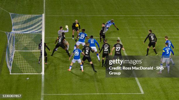 Kilmarnock's Youssouf Mulumbu has a chance saved by Livingston goalkeeper Max Stryjek during the Scottish Premiership match between Kilmarnock and...