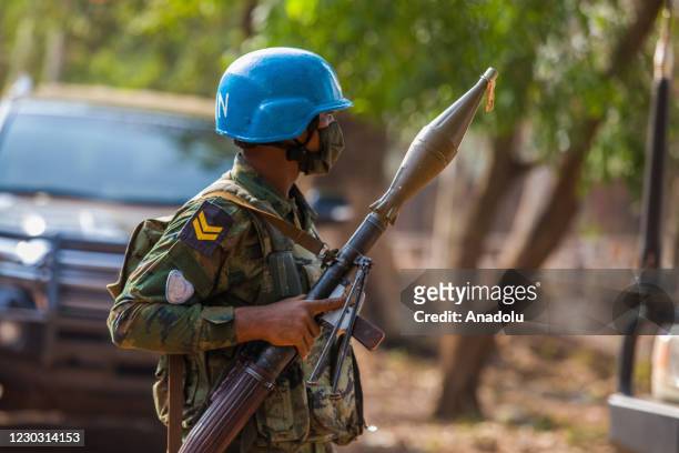 Rwandan peacekeeper of the United Nations Multidimensional Integrated Stabilization Mission in the Central African Republic stands guard with an RPG...