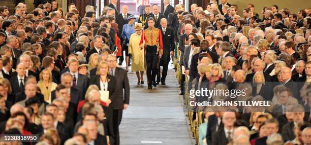 Britain's Queen Elizabeth II and Prince Philip, Duke of Edinburgh, walk into Westminster Hall in London on March 20, 2012 to receive Loyal Addresses...
