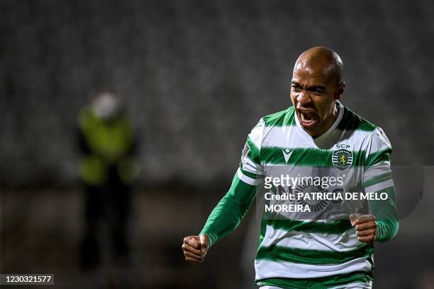 Sporting's Portuguese midfielder Joao Mario celebrates his goal during the Portuguese league football match between Belenenses SAD and Sporting CP at...