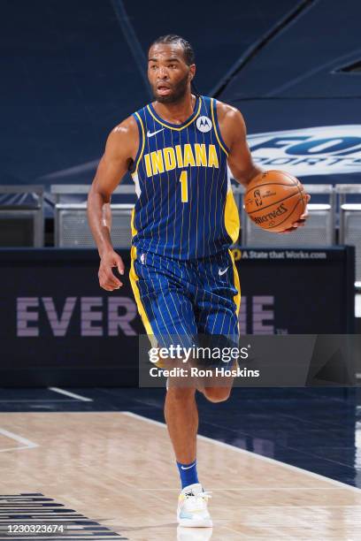 Warren of the Indiana Pacers dribbles the ball during the game against the Boston Celtics on December 27, 2020 at Bankers Life Fieldhouse in...