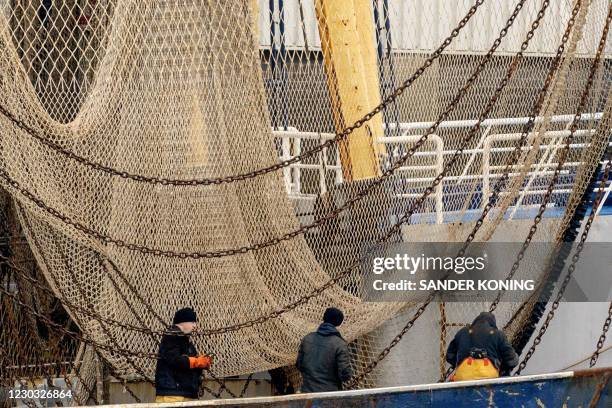 Fishermen are at work in the port of IJmuiden, on December 28, 2020. - Due to the Brexit deal, Dutch fishermen will be allowed to catch a quarter...