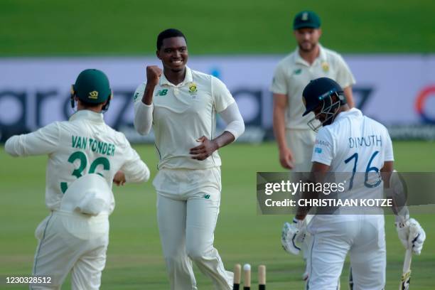 South Africa's Lungi Ngidi celebrates after the dismissal of Sri Lanka's captain Dimuth Karunaratne during the third day of the first Test cricket...