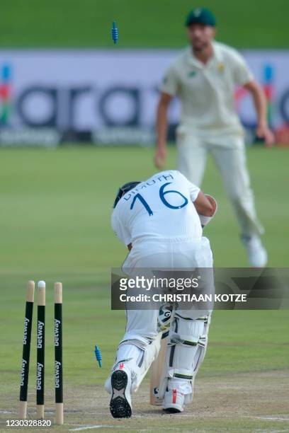 Sri Lanka's captain Dimuth Karunaratne is bowled by South Africa's Lungi Ngidi during the third day of the first Test cricket match between South...