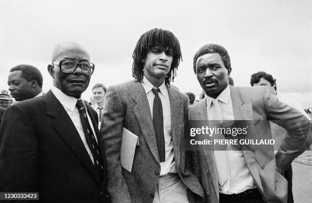 This picture taken on June 20, 1983 in Yaounde shows French tennisman Yannick Noah flanked by his father Zacharie Noah , a former Cameroonian...