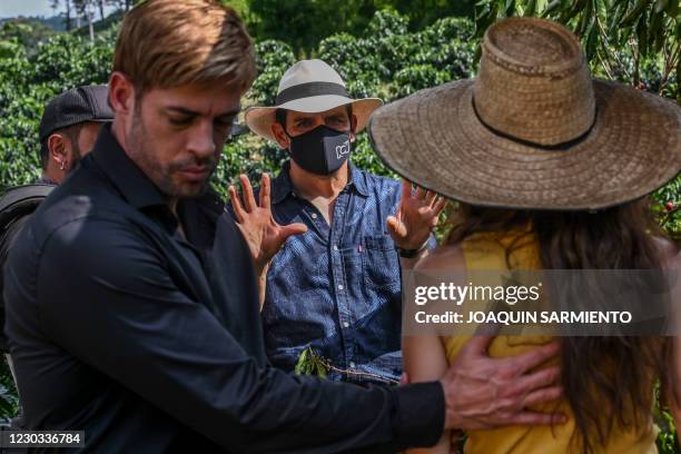 Director Mauricio Cruz rehearses a scene with Colombian actress Laura Londono and Cuban actor William Levy during the production of a new version of...