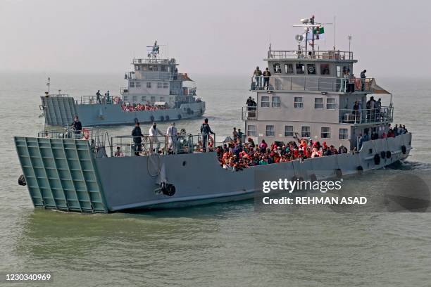 Rohingya refugees are seen on Bangladesh Navy ships as they are relocated to the controversial flood-prone island Bhashan Char in the Bay of Bengal,...