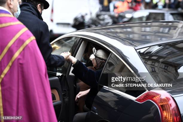 Michele Cambon-Brasseur and Alexandre Brasseur , respectively widow and son of late French actor Claude Brasseur arrive at Saint-Roch church prior to...