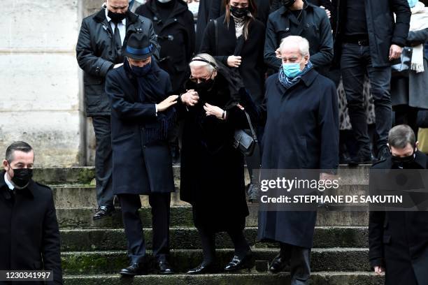 Michele Cambon-Brasseur and Alexandre Brasseur , respectively widow and son of late French actor Claude Brasseur, leave the Saint-Roch church, at the...