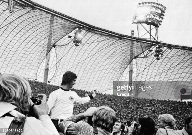 Gerd Müller of West Germany is carried in triumph by team mates in the Olympic Stadium in Munich on July 07, 1974 after West Germany became World...