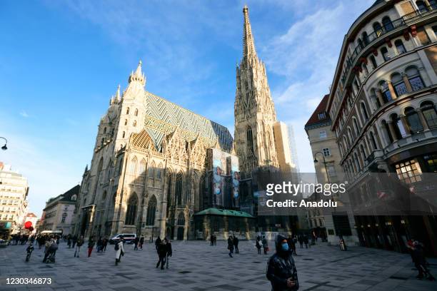 People are seen at Stephansplatz with Saint Stephens Cathedral as third partial lockdown imposed due to the pandemic allowing only shops for...