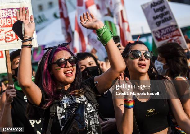 Pro-choice demonstrators shout slogans outside the National Congress as senators decide on legalization of abortion on December 29, 2020 in Buenos...