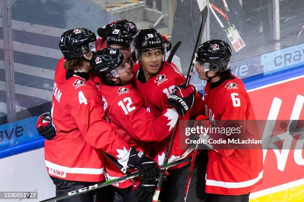 Bowen Byram, Jakob Pelletier, Jack Quinn, Quinton Byfield and Jamie Drysdale of Canada celebrate Byfield's goal against Switzerland during the 2021...