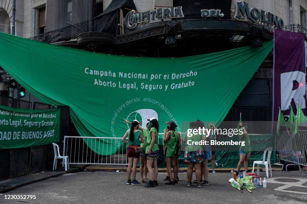 Abortion-rights activists gather outside the Palace of the Argentine National Congress in Buenos Aires, Argentina, on Tuesday, Dec. 29, 2020....