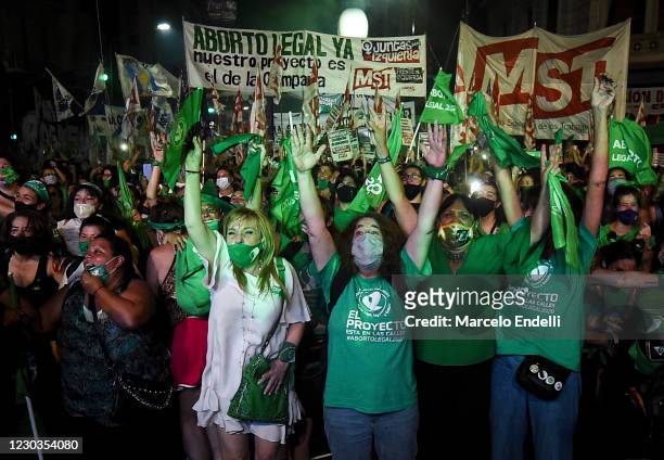 Pro-choice demonstrators celebrate after the right to an abortion is legalized on December 30, 2020 in Buenos Aires, Argentina. The proposal...