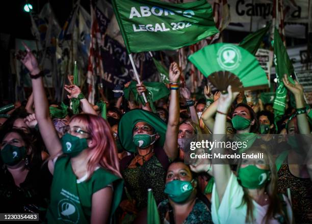 Pro-choice demonstrators celebrate after the right to an abortion is legalized on December 30, 2020 in Buenos Aires, Argentina. The proposal...