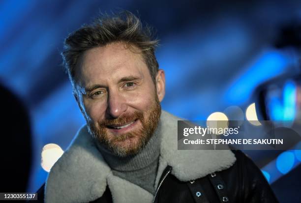 French DJ David Guetta poses on the stage set up for his 2021 New Year's eve livestream charity concert "United at Home", in the Louvre's Cour...