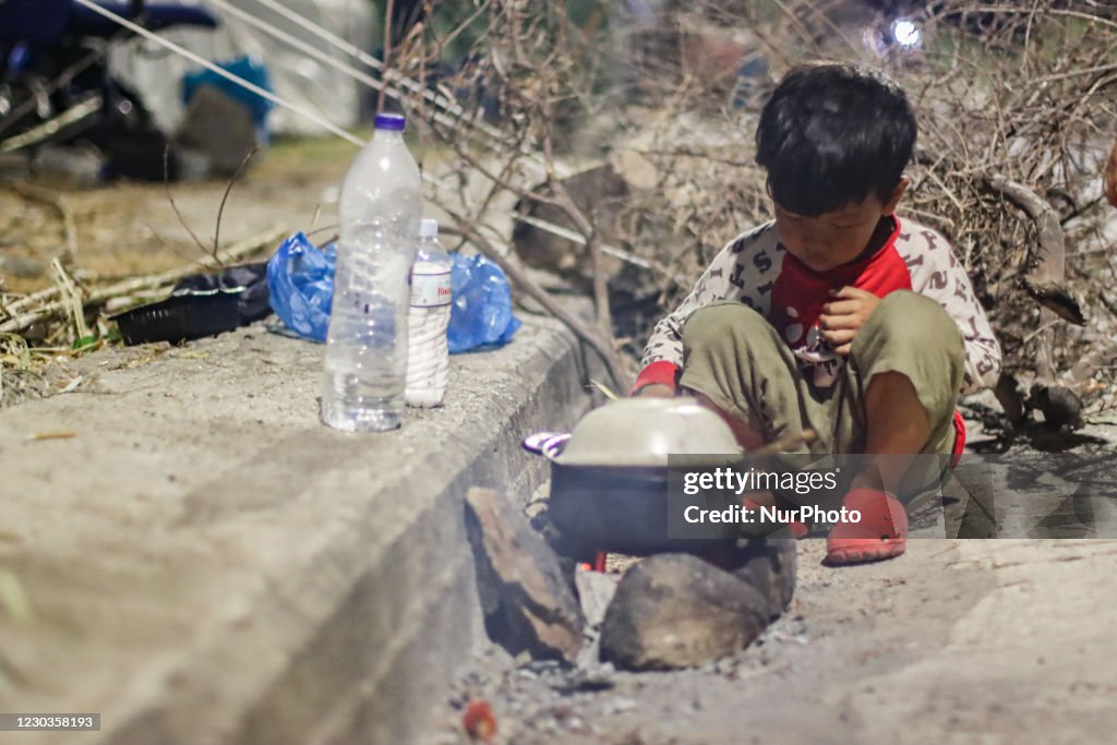 Refugees In Lesbos Island Cooking On The Road