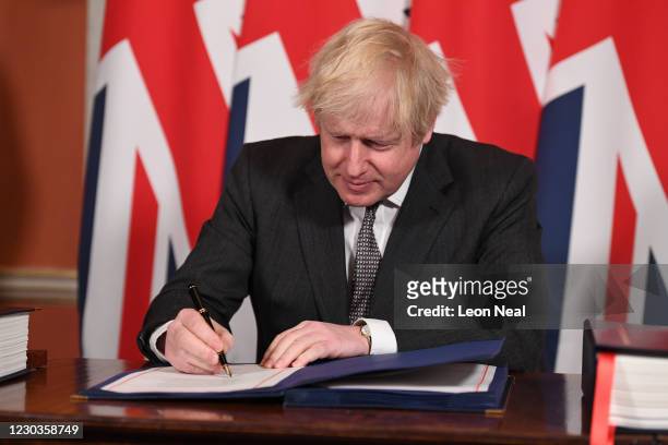 Prime Minister, Boris Johnson signs the Brexit trade deal with the EU in number 10 Downing Street on December 30, 2020 in London, United Kingdom. The...