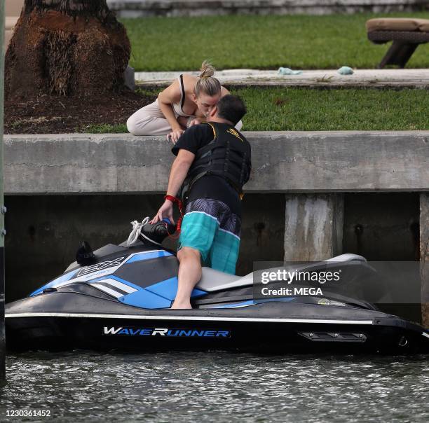 Pregnant "Vanderpump Rules" star Lala Kent gives fiancé Randall Emmett a quick kiss as he take a break from zooming around on his wave runner...