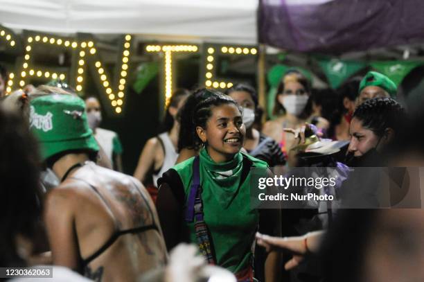 Abortion-rights activists rally outside Congress as lawmakers debate a bill that would legalize abortion, in Buenos Aires, Argentina, Tuesday, Dec....